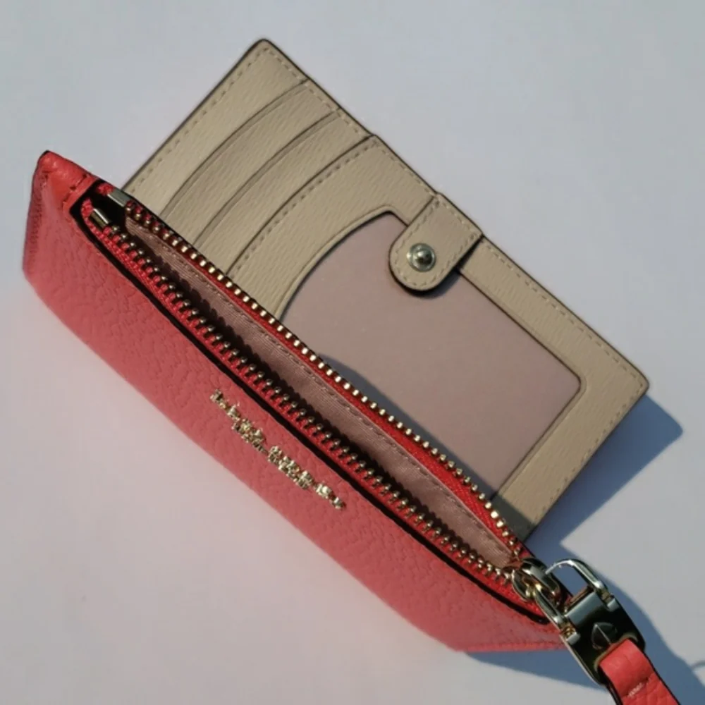 Kate Spade Leather Roulette Small Slim Bifold Wallet. Color: Peachmelba.